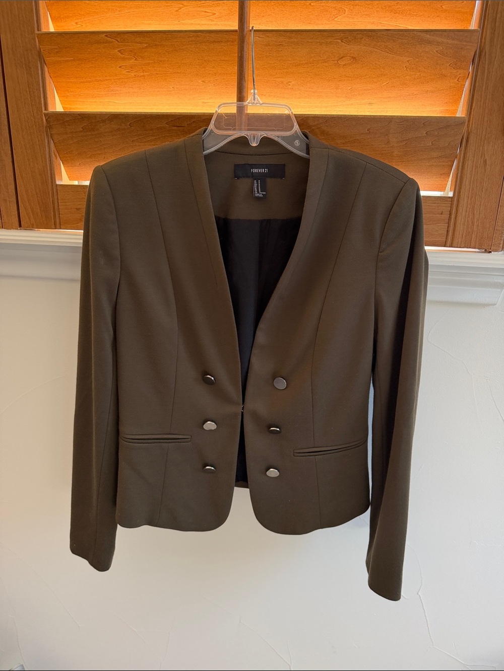 Olive green blazer in very good condition. Lots of stylish details